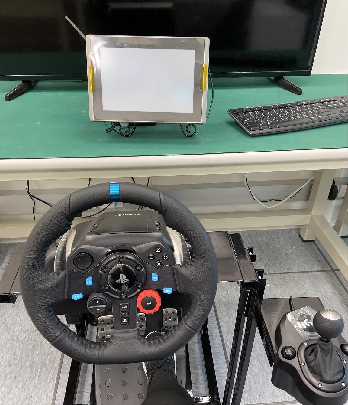 Steering wheel and pedal rig used to test the dashboard HMI display