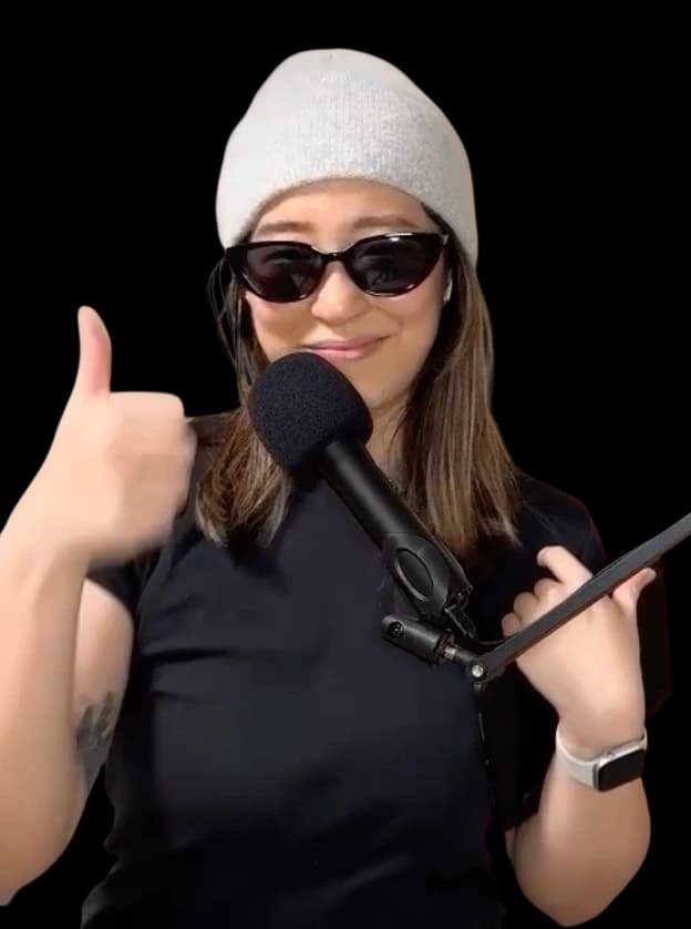 Effy hosting the Wanlu podcast, giving a thumbs up behind a microphone
